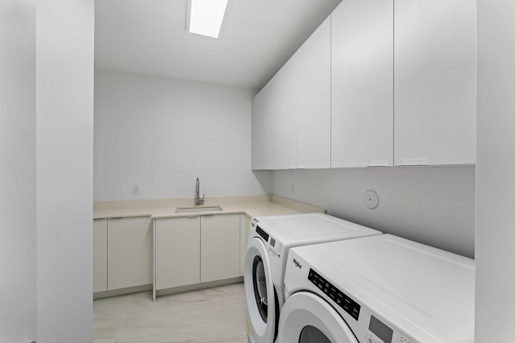 423 Ocean One Lane Juno Beach, FL 33408 - Photo 39 of 58 a utility room with dryer and washer