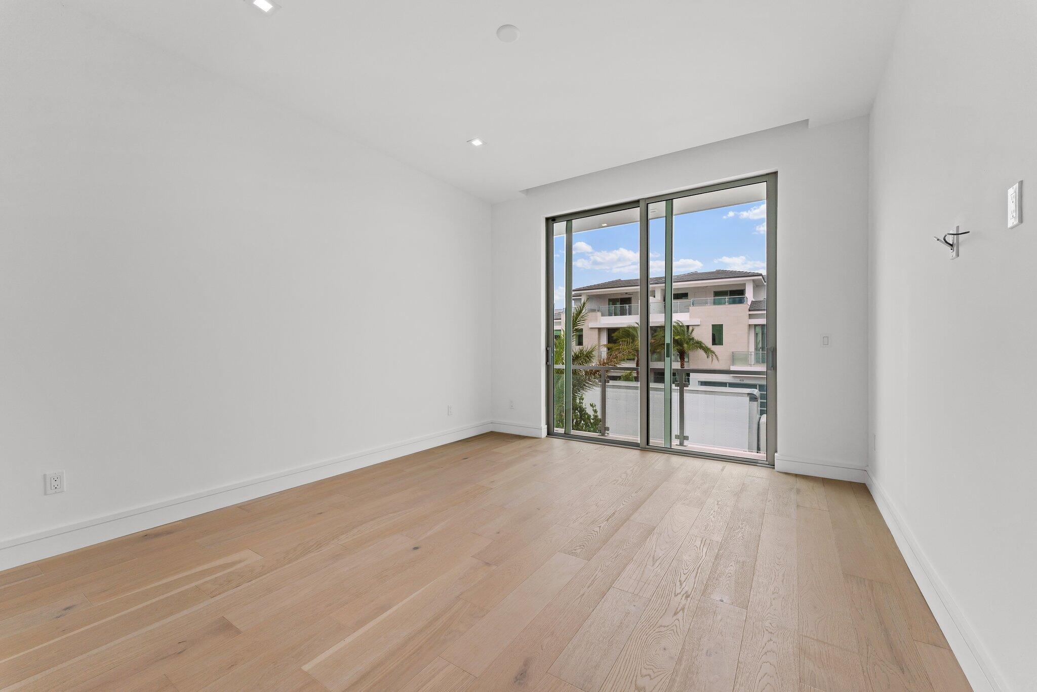 423 Ocean One Lane Juno Beach, FL 33408 - Photo 43 of 58 a view of empty room with wooden floor