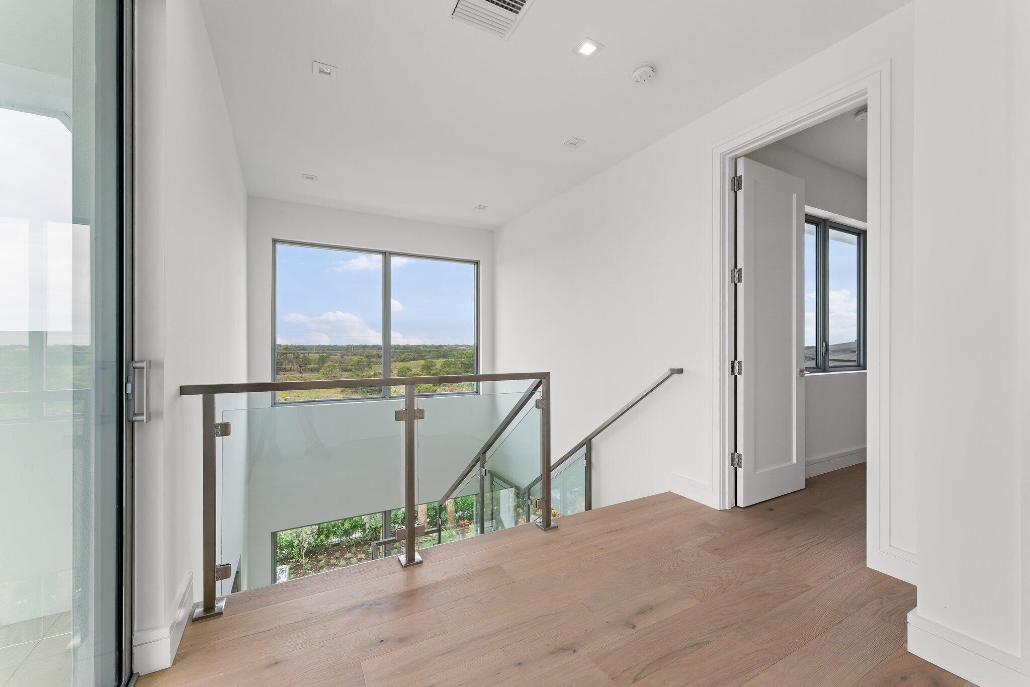 423 Ocean One Lane Juno Beach, FL 33408 - Photo 46 of 58 a view of a hallway with a window