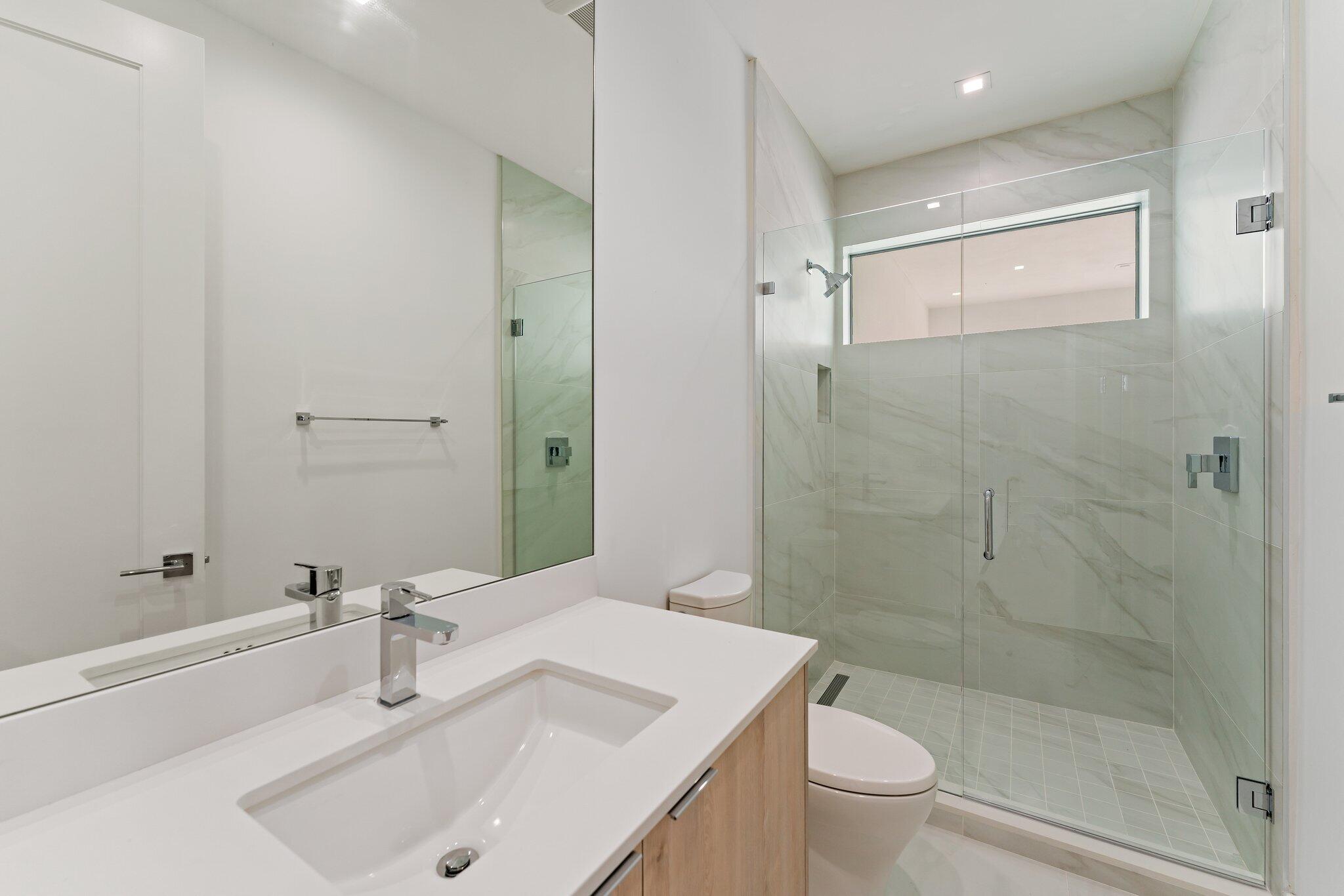 423 Ocean One Lane Juno Beach, FL 33408 - Photo 50 of 58 a bathroom with a sink toilet and shower