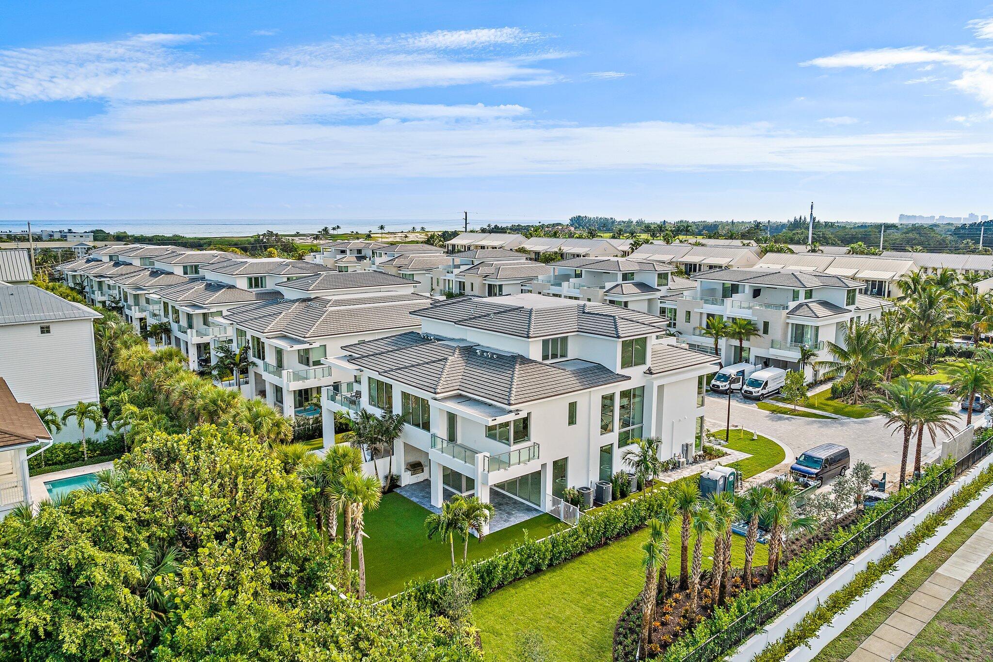 423 Ocean One Lane Juno Beach, FL 33408 - Photo 53 of 58 an aerial view of a house with a garden