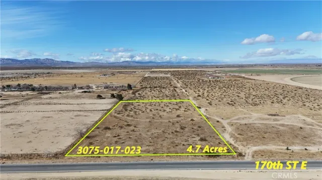 a view of a water with a field