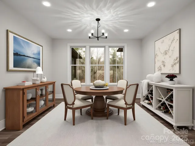 a dining room with furniture window and wooden floor