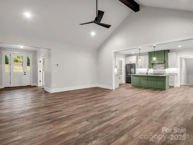 a view of a kitchen with a sink and a stove top oven