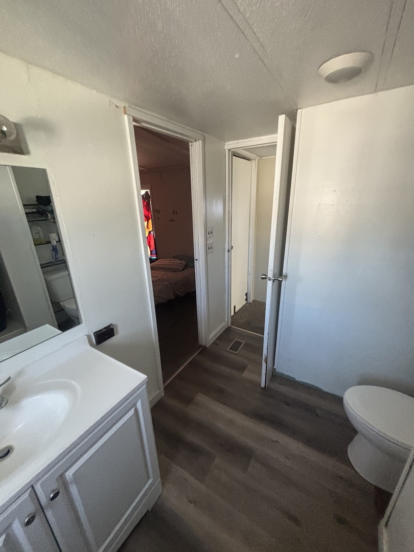 1712 South Dixie Highway, Unit 47 Crete, IL 60417 - Photo 8 of 12 a bathroom with a sink and toilet