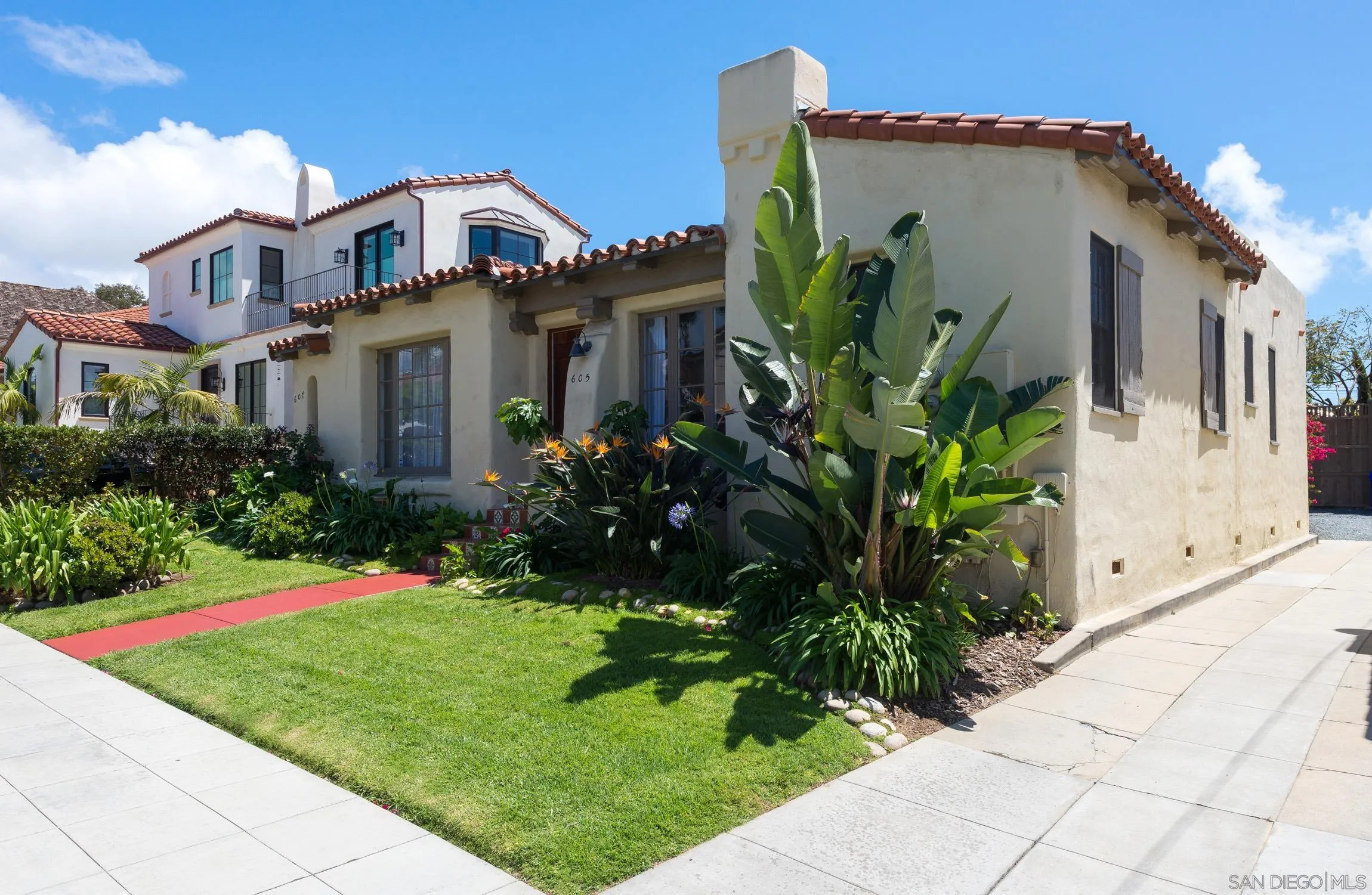 605 Arenas Street La Jolla, CA 92037 - Photo 1 of 25 a front view of a house with a garden