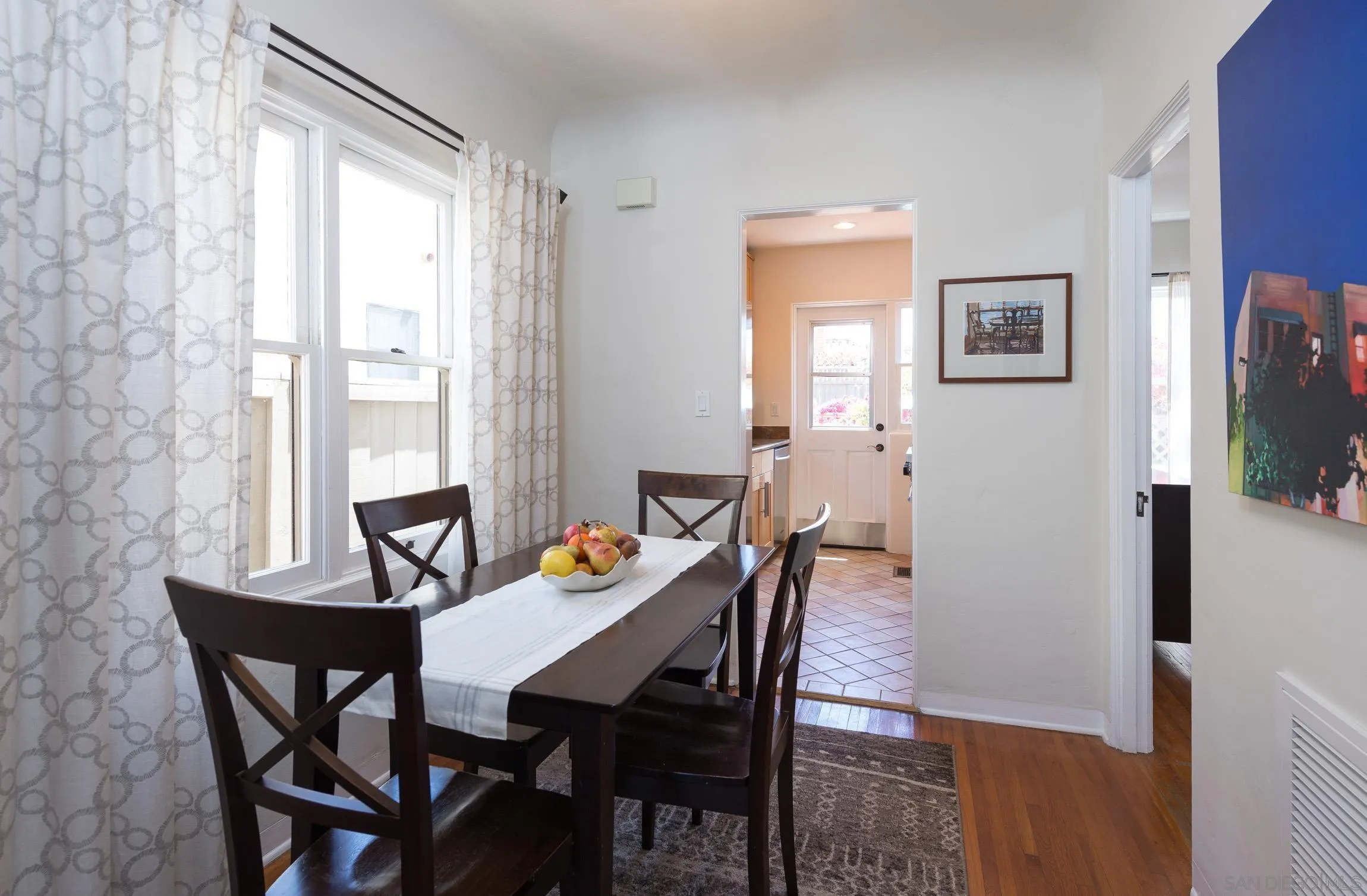 605 Arenas Street La Jolla, CA 92037 - Photo 13 of 25 a view of a dining room with furniture and window