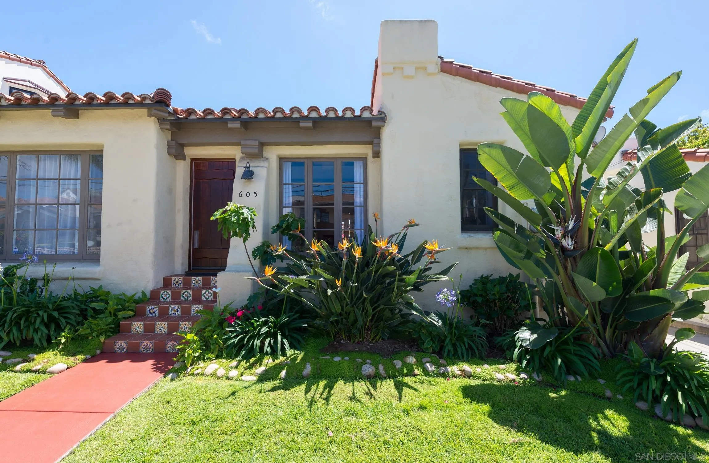 605 Arenas Street La Jolla, CA 92037 - Photo 2 of 25 a flower plants in front of a house