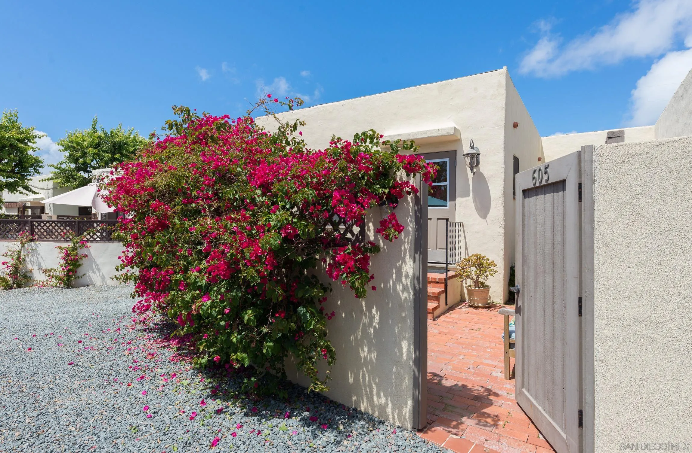 605 Arenas Street La Jolla, CA 92037 - Photo 24 of 25 a front view of a house with a lot of flowers around