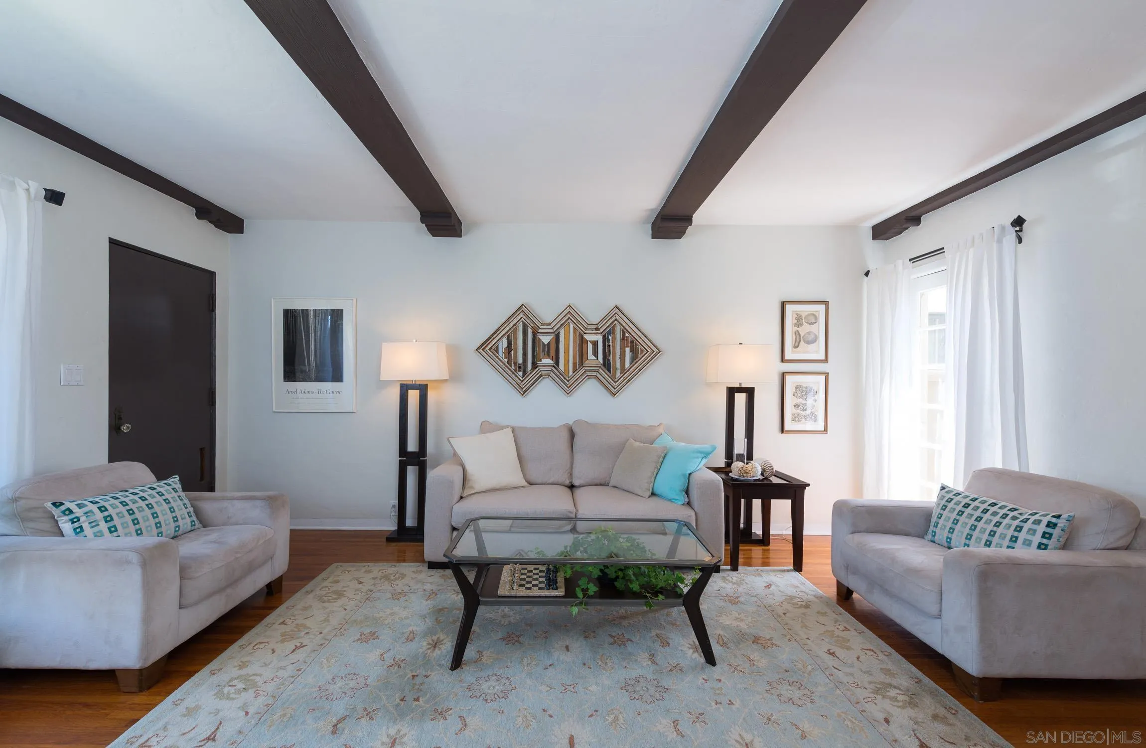 605 Arenas Street La Jolla, CA 92037 - Photo 6 of 25 a living room with furniture and a large window
