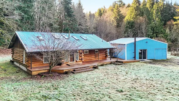 an outdoor space with pool and furniture