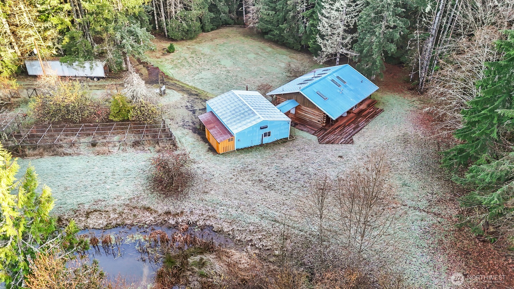 194 Piper Lane Chehalis, WA 98532 - Photo 30 of 40 an aerial view of a house with yard and trees in the background