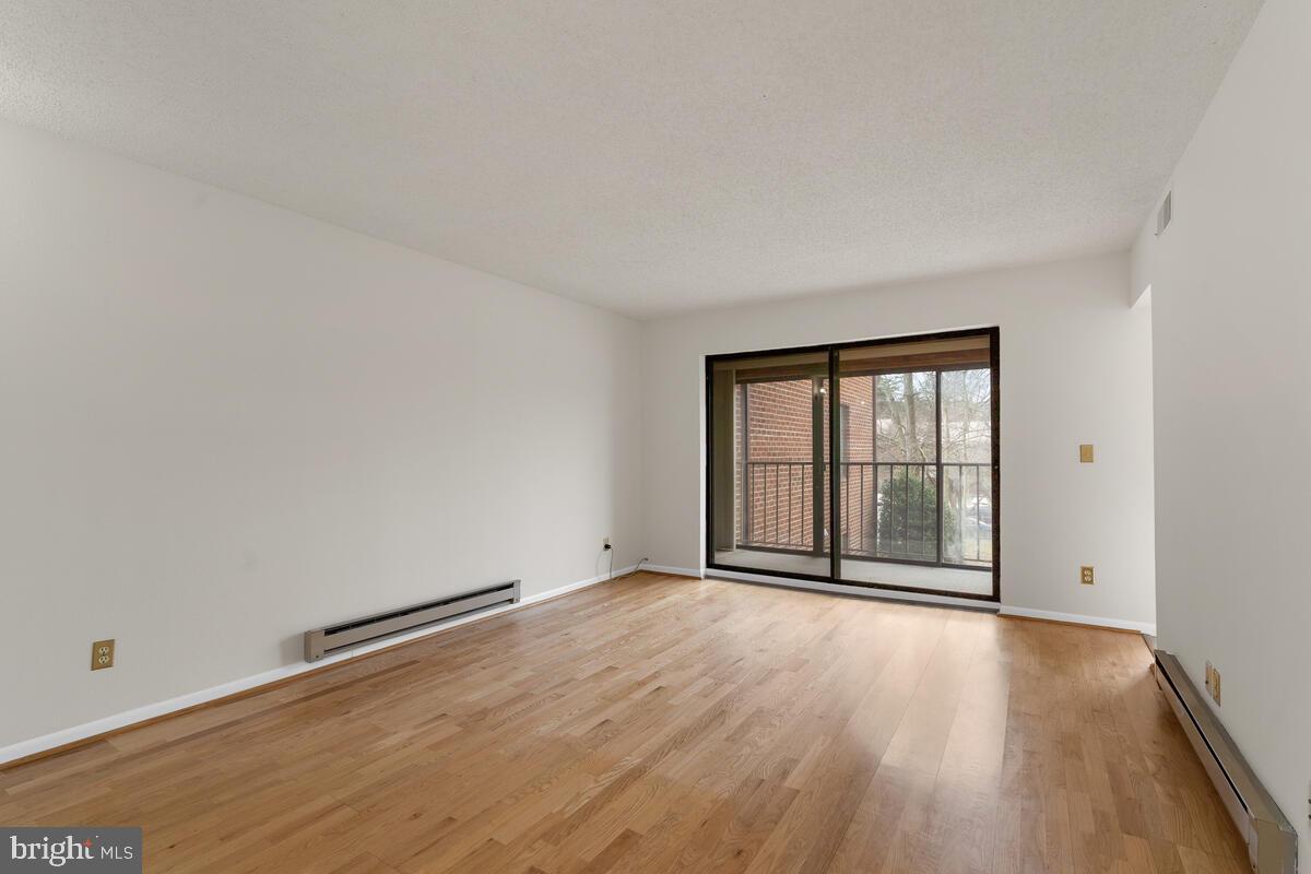 15311 Beaverbrook Court, Unit 902D Silver Spring, MD 20906 - Photo 6 of 30 Standing in Dining Room, looking out onto balcony