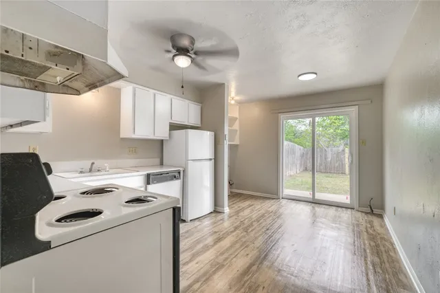 a view of kitchen and wooden floor