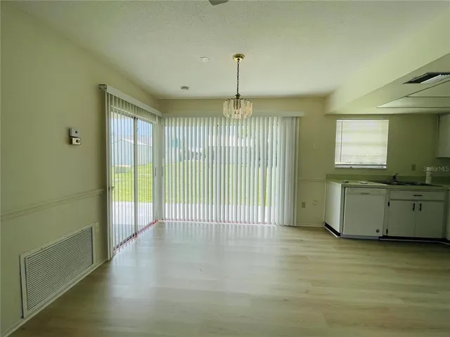 a view of a kitchen with a sink and a window