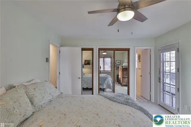 a bedroom with a large bed and a window