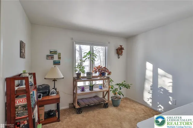 a bed room with a bed and a book shelf