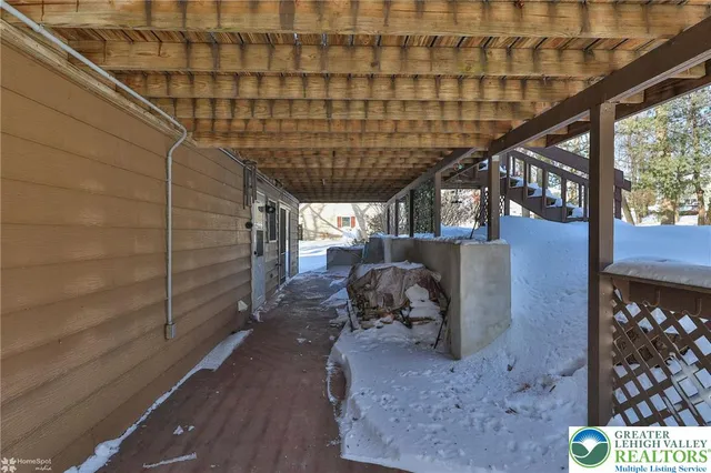 a view of a house with wooden deck