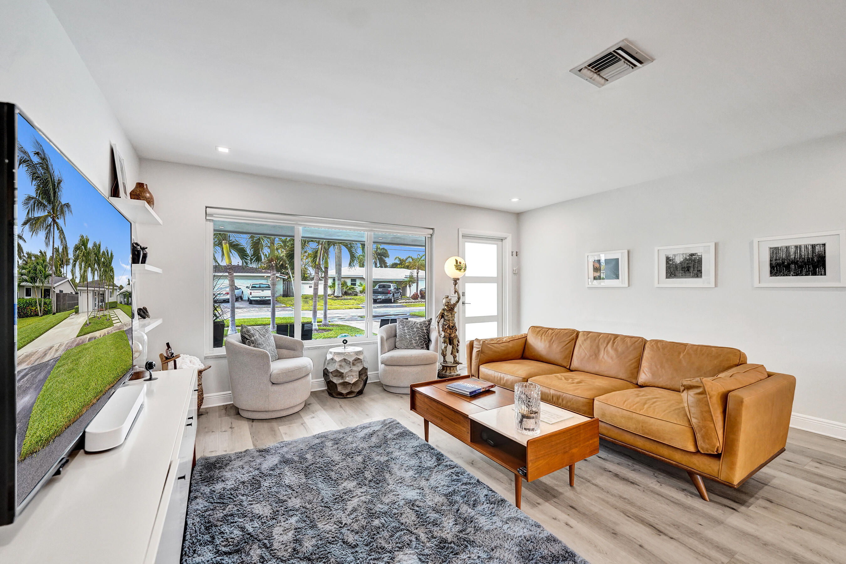 381 Southeast 3rd Street Pompano Beach, FL 33060 - Photo 4 of 41 a living room with furniture and a wooden floor