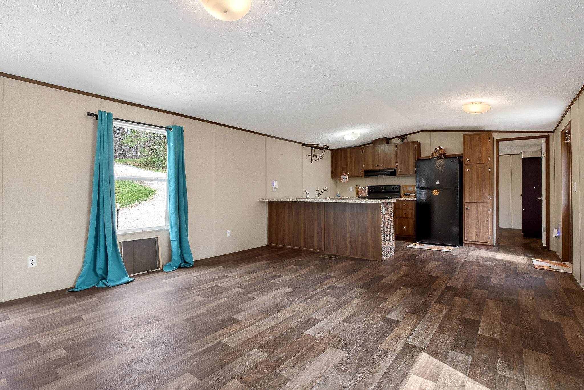 1237 Ridge Road Quebeck, TN 38579 - Photo 15 of 47 a view of a kitchen with a sink cabinets and a ceiling fan