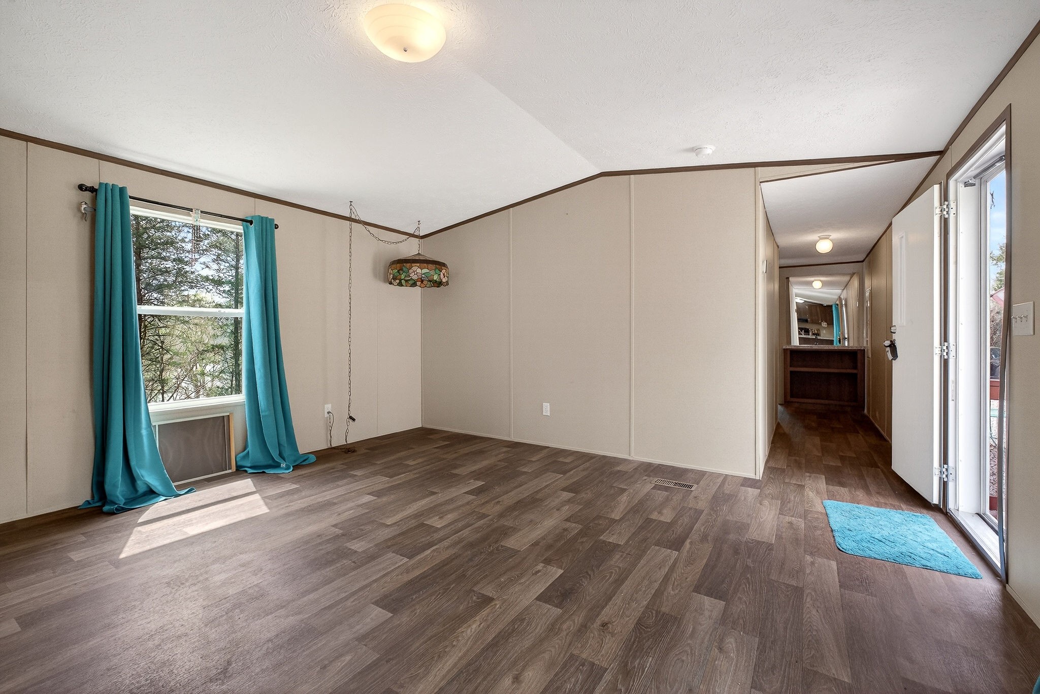 1237 Ridge Road Quebeck, TN 38579 - Photo 17 of 47 a view of an empty room with wooden floor and a window