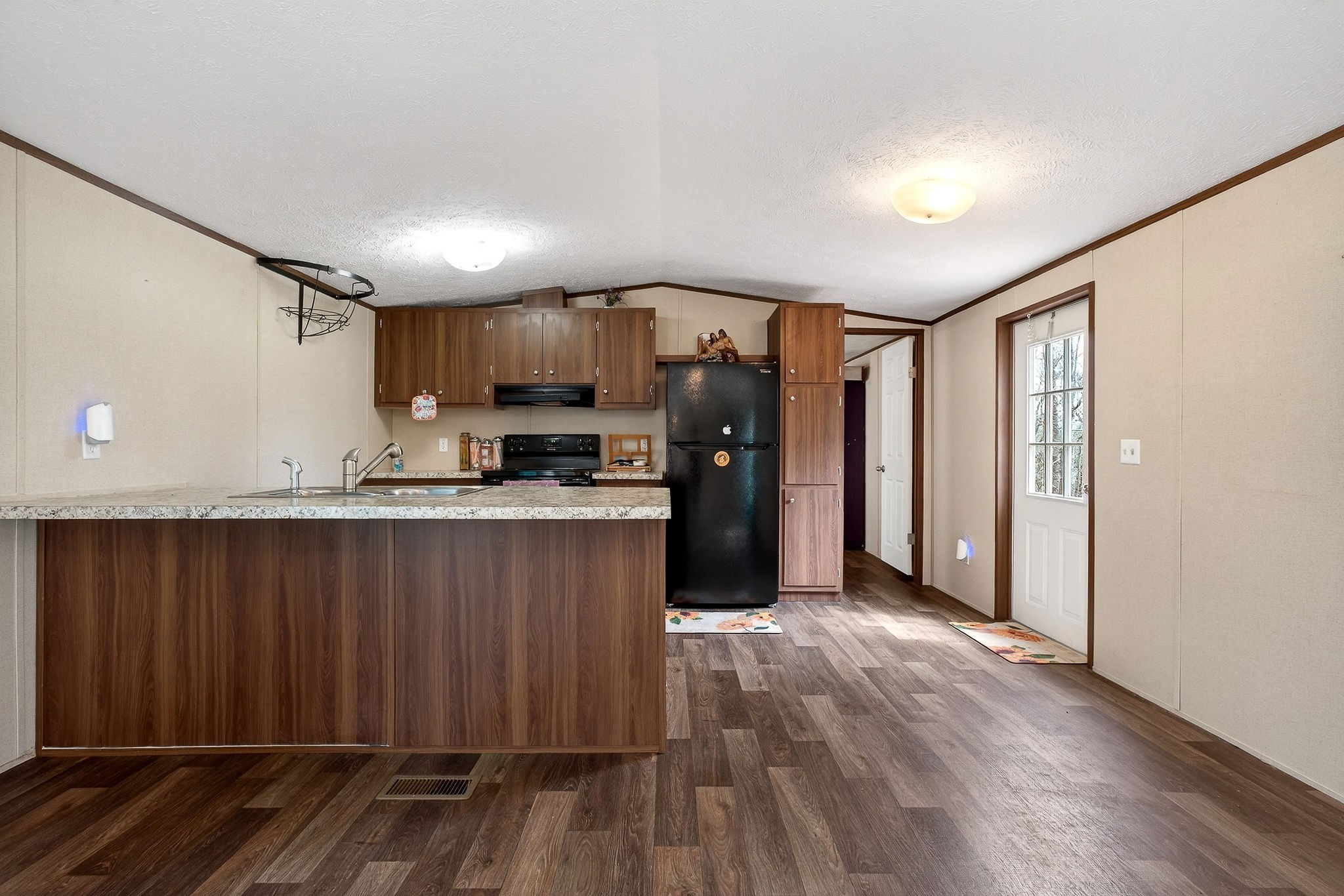 1237 Ridge Road Quebeck, TN 38579 - Photo 18 of 47 a view of kitchen with refrigerator and wooden floor