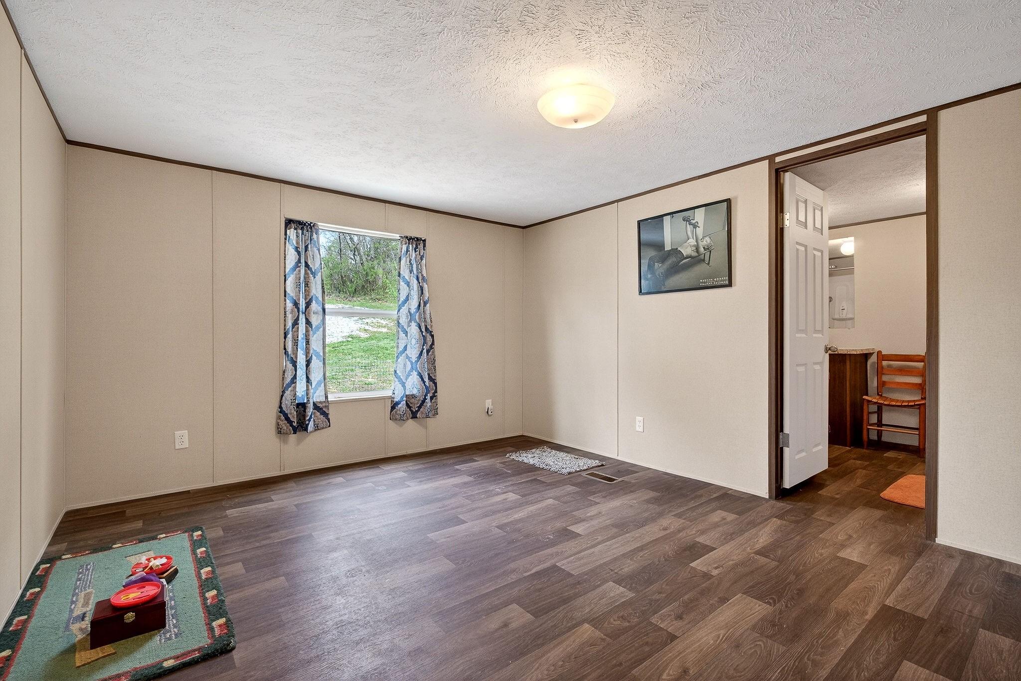 1237 Ridge Road Quebeck, TN 38579 - Photo 22 of 47 an empty room with wooden floor and window