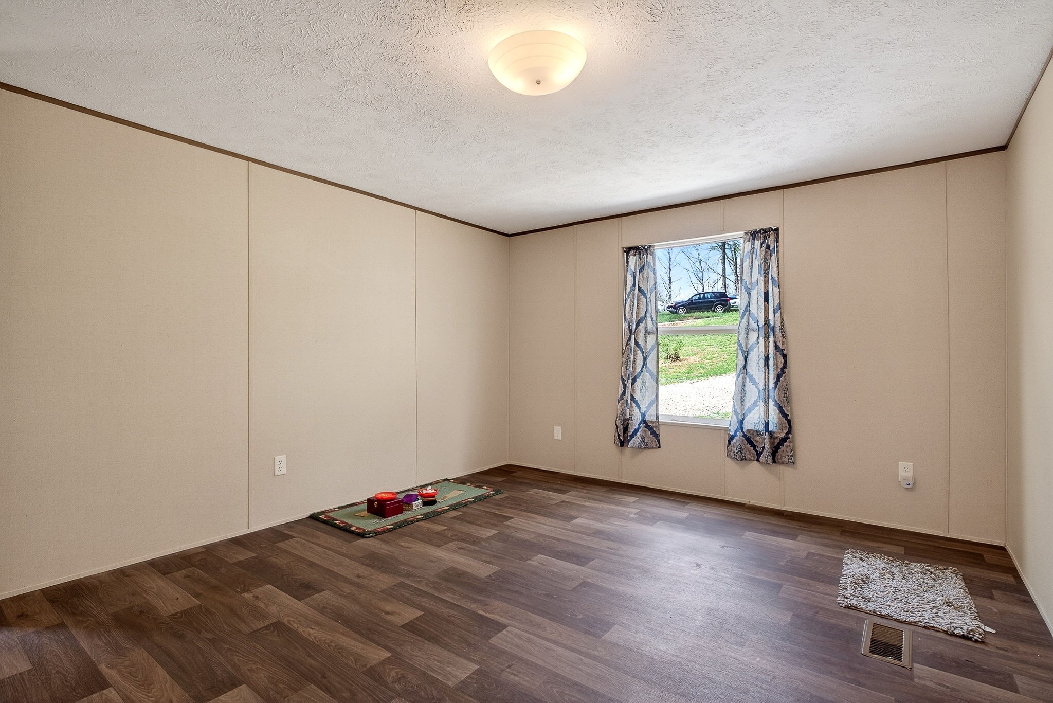 1237 Ridge Road Quebeck, TN 38579 - Photo 23 of 47 an empty room with wooden floor and windows