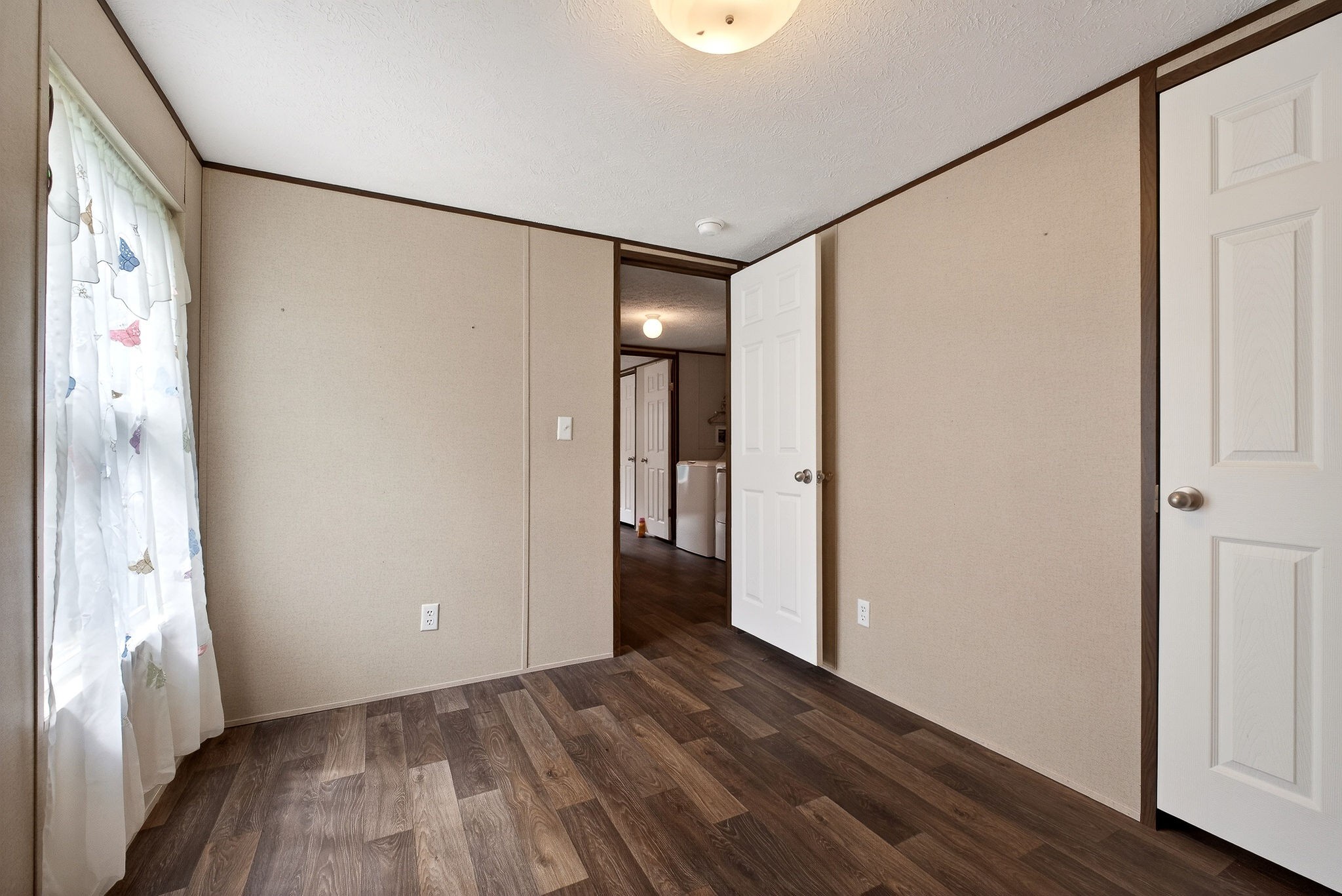 1237 Ridge Road Quebeck, TN 38579 - Photo 30 of 47 a view of an empty room with wooden floor and a window