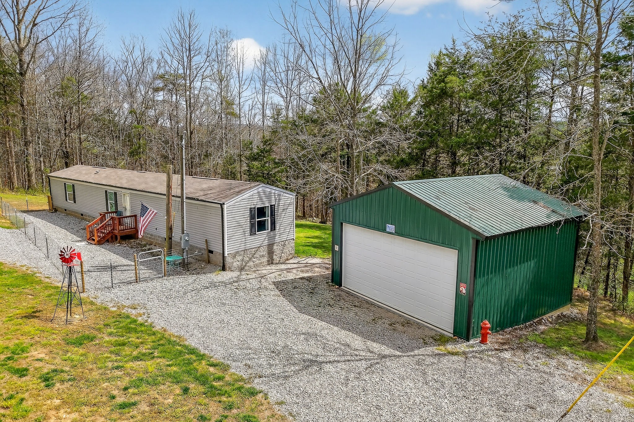 1237 Ridge Road Quebeck, TN 38579 - Photo 3 of 47 a view of a house with a yard and garage