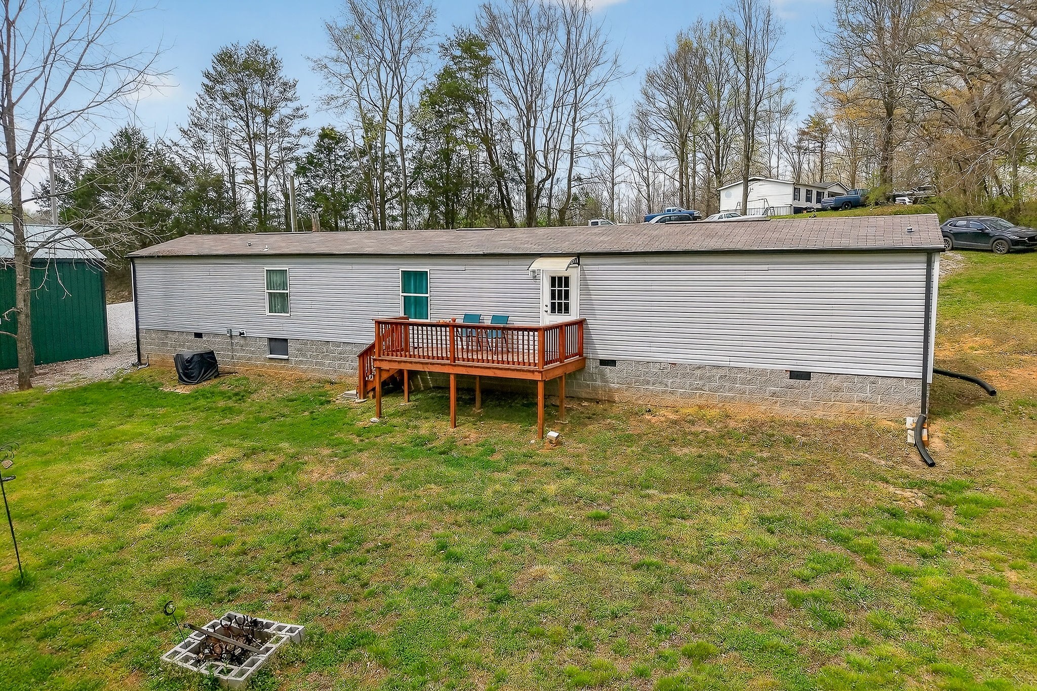 1237 Ridge Road Quebeck, TN 38579 - Photo 4 of 47 a backyard of a house with table and chairs