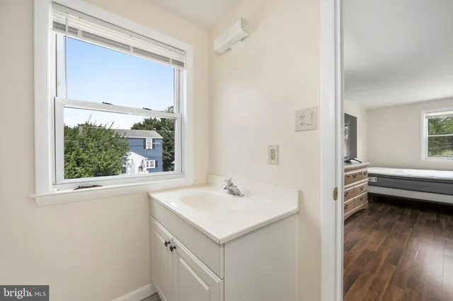 a bed room with a bed and a window