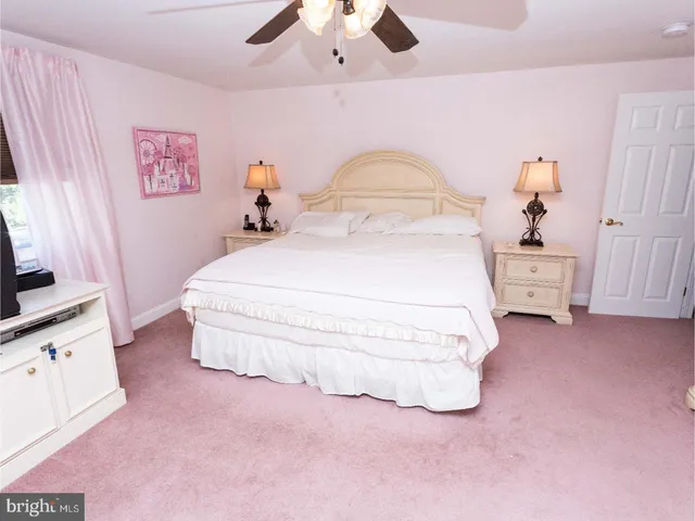 a bed room with a bed and a chandelier