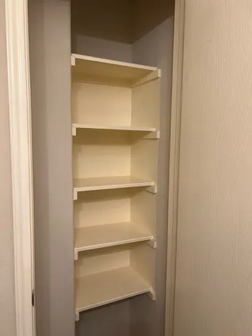 a empty closet with white paint