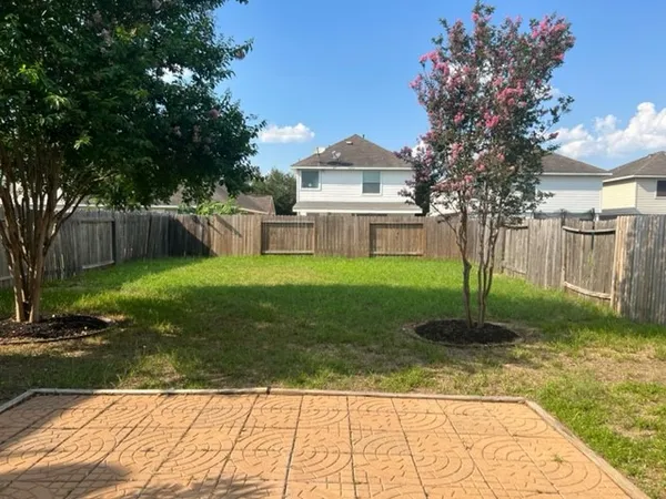 a view of a backyard with a garden
