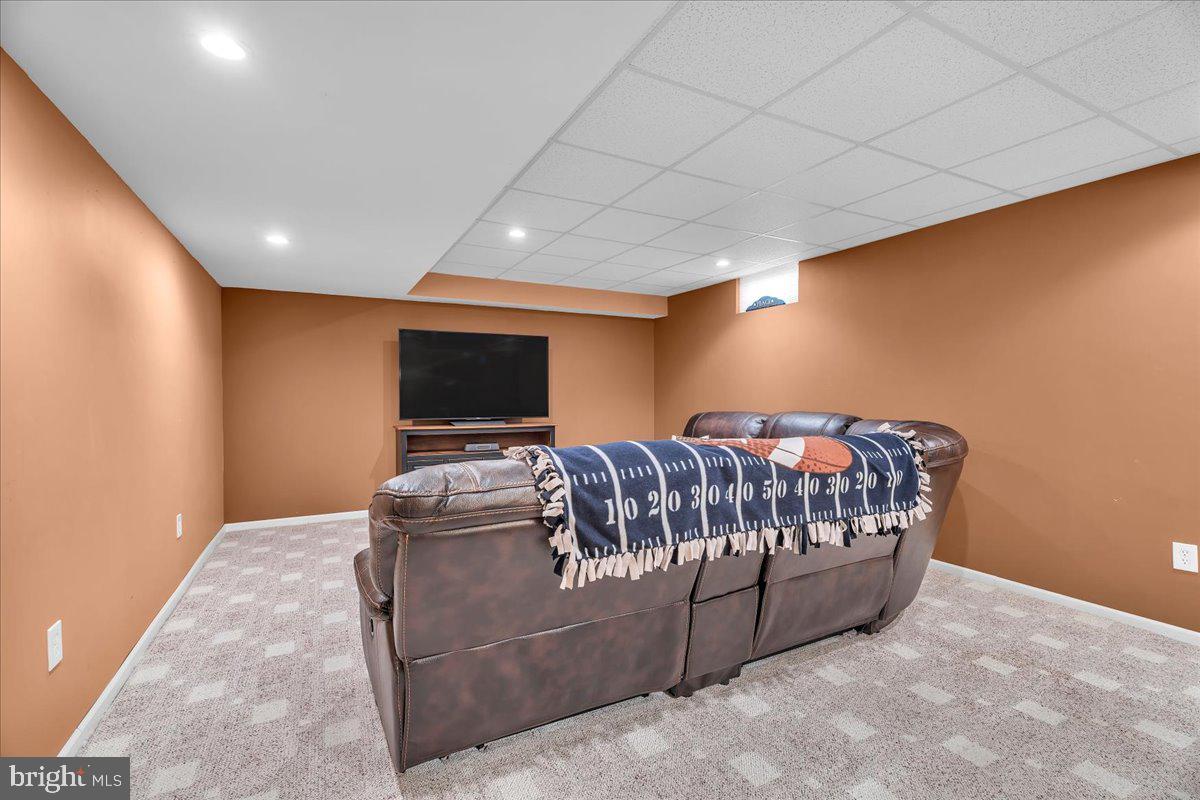 74 Candlewood Road Williamstown, NJ 08094 - Photo 31 of 45 Cozy basement retreat with warm tones.
