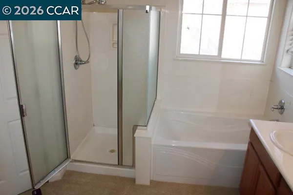 a white toilet sitting next to a window
