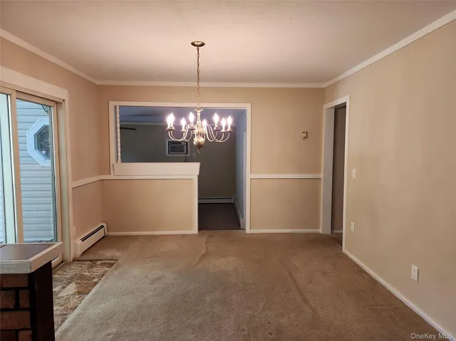 a view of a room with a windows and ceiling fan