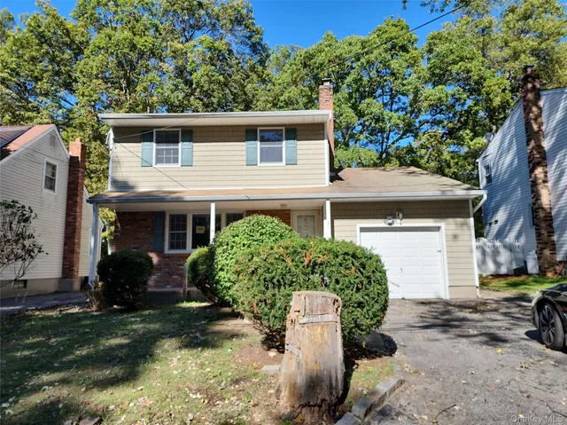 a house view with a backyard space