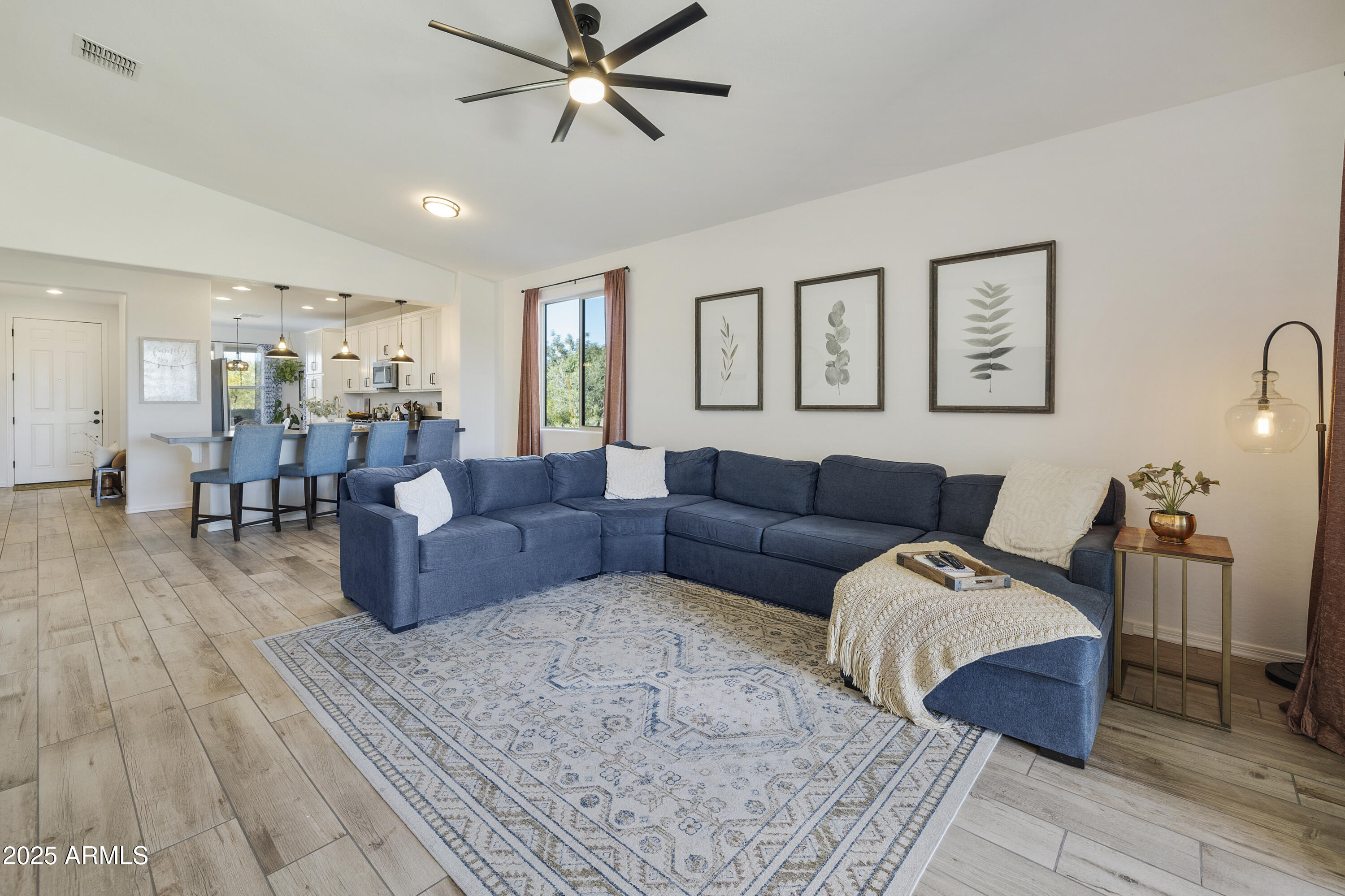 5813 South Del Rancho Mesa, AZ 85212 - Photo 12 of 47 a living room with furniture and wooden floor