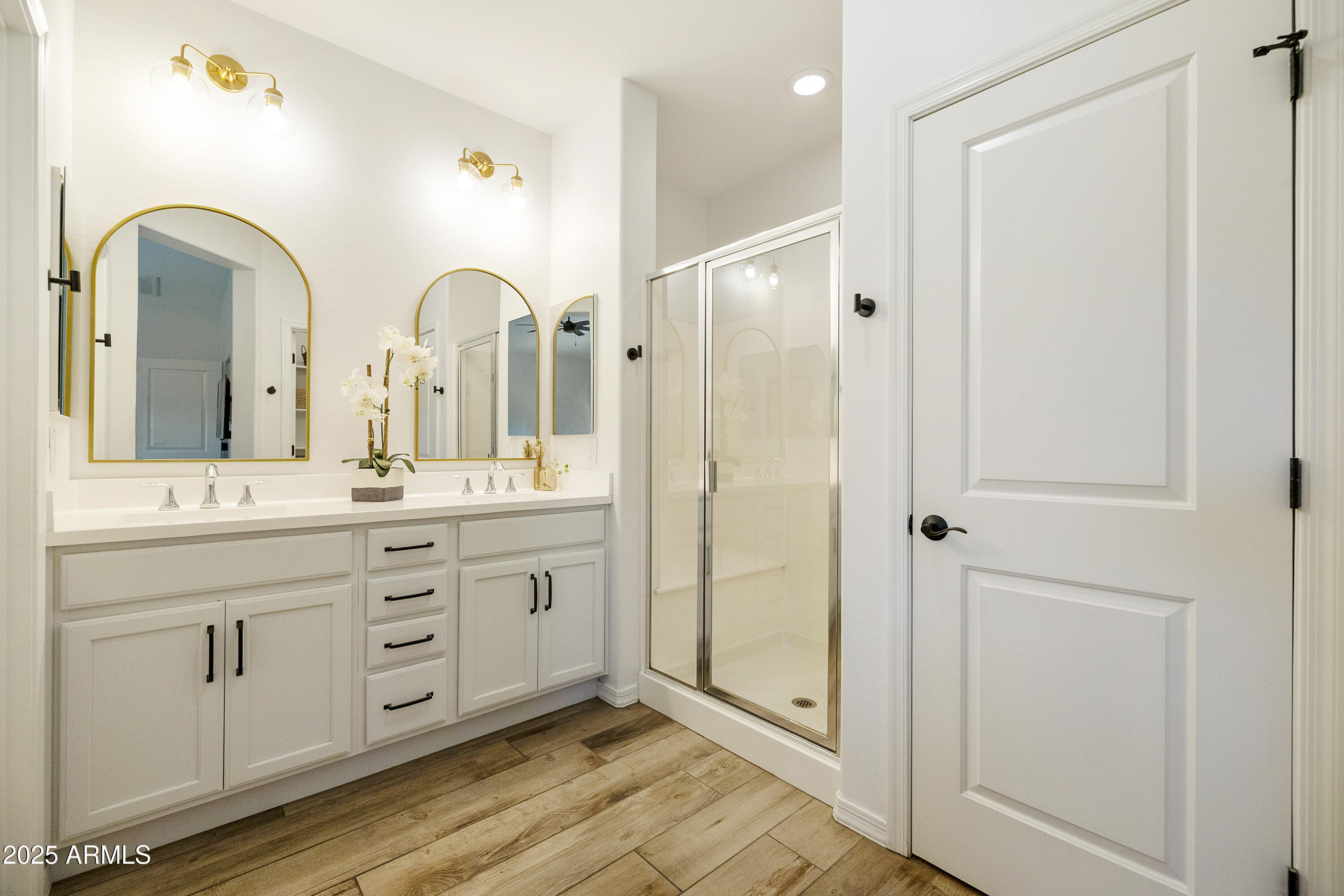 5813 South Del Rancho Mesa, AZ 85212 - Photo 17 of 47 a spacious bathroom with a double vanity sink a mirror and a shower