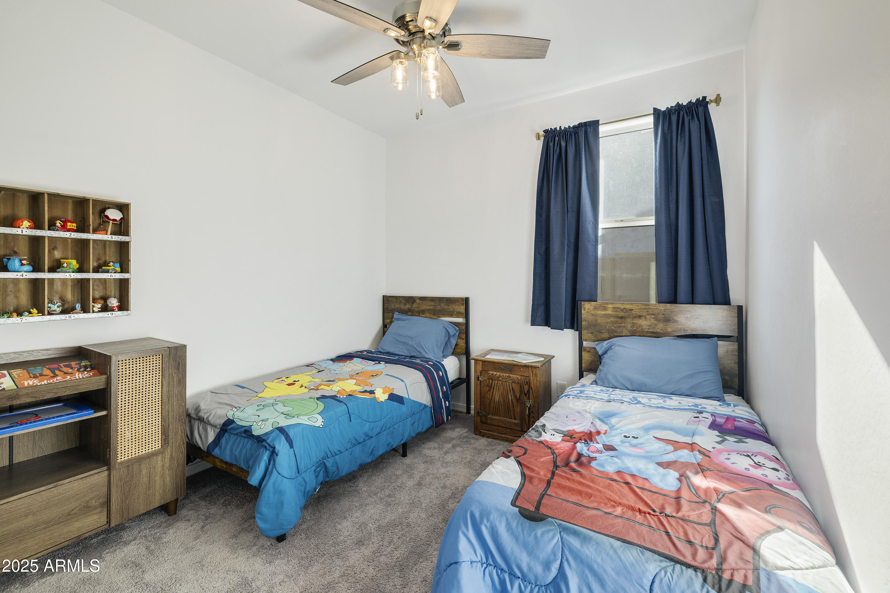 5813 South Del Rancho Mesa, AZ 85212 - Photo 18 of 47 a bedroom with two beds and a chandelier