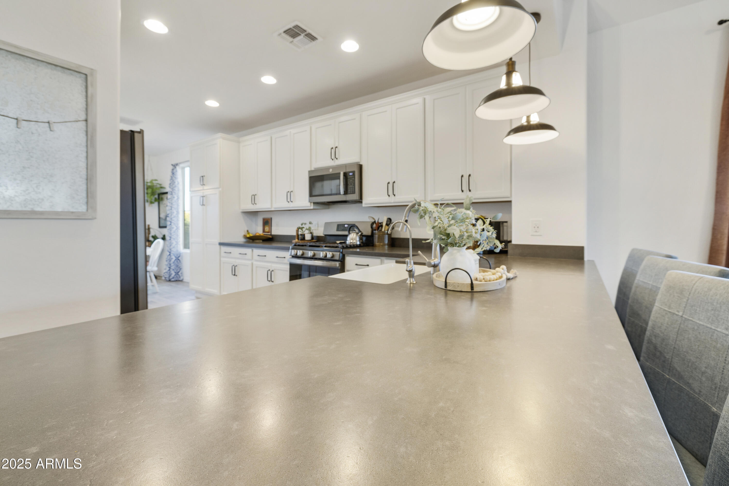 5813 South Del Rancho Mesa, AZ 85212 - Photo 3 of 47 a living room with stainless steel appliances furniture a rug and a view