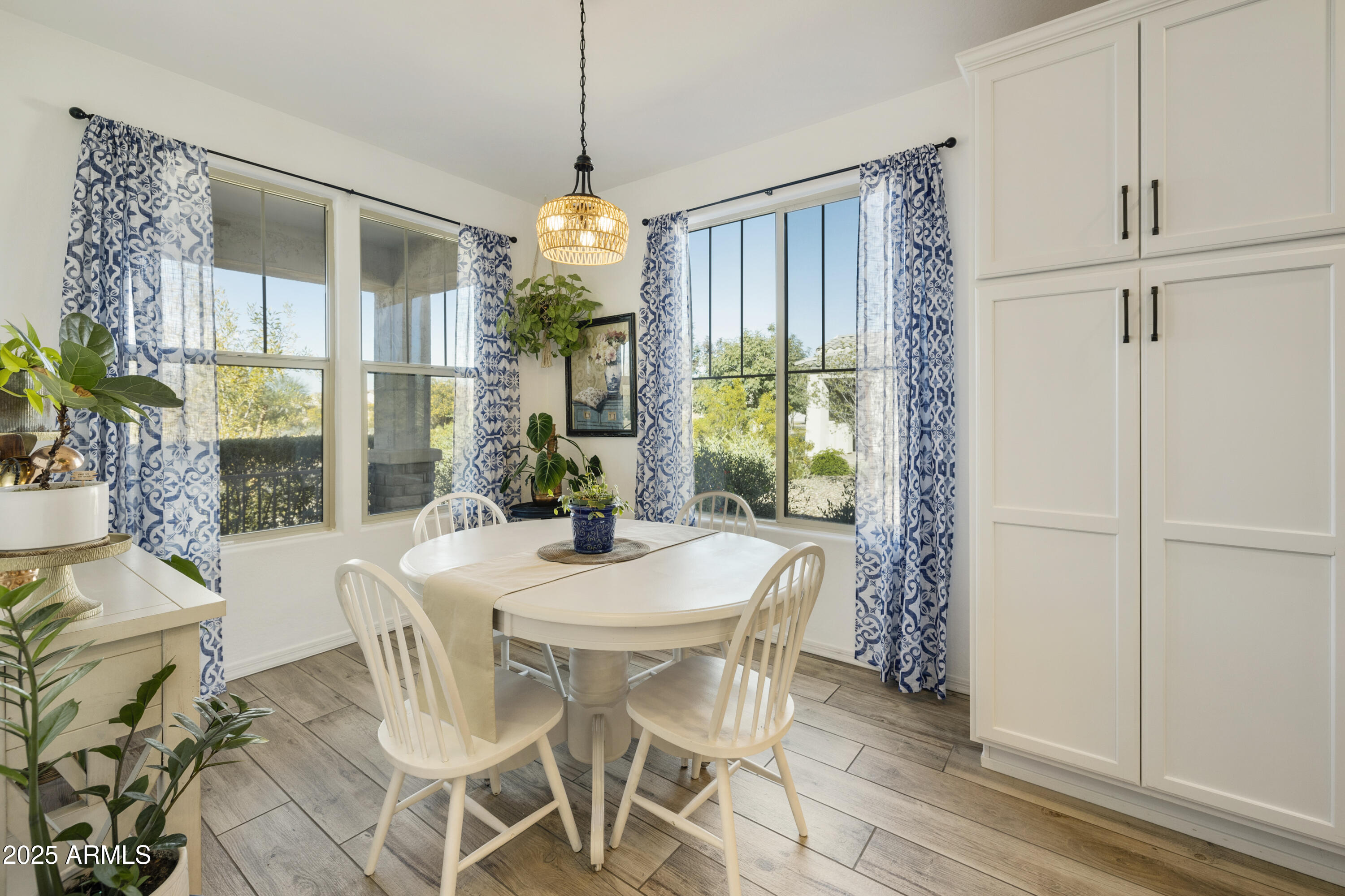5813 South Del Rancho Mesa, AZ 85212 - Photo 8 of 47 a view of a dining room with furniture window and wooden floor