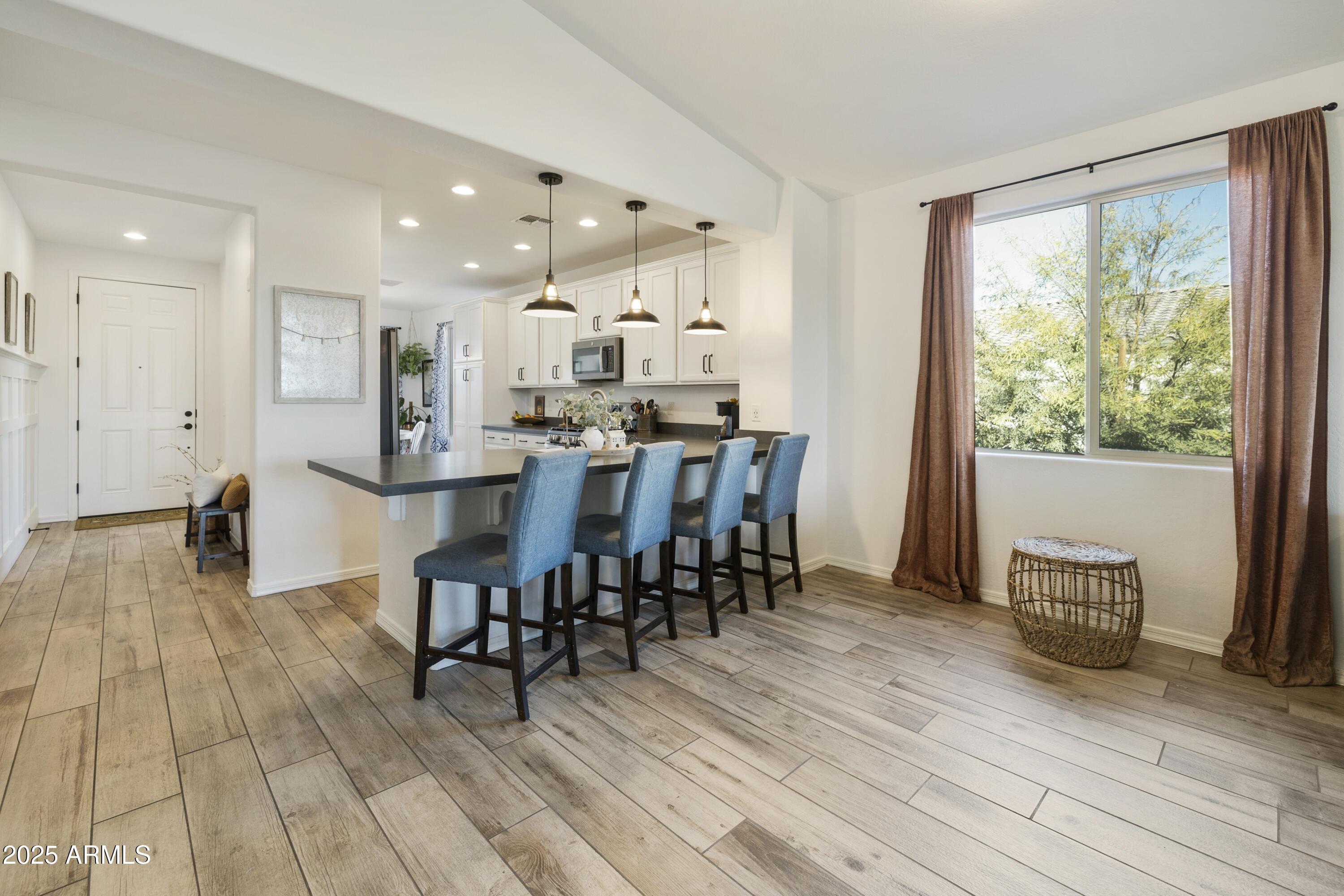 5813 South Del Rancho Mesa, AZ 85212 - Photo 10 of 47 a view of a dining room with furniture and wooden floor