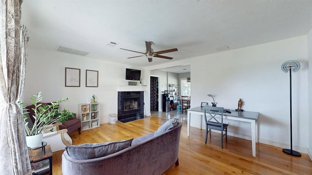 1766 Boss Range Road Justin, TX 76247 - Photo 13 of 35 a living room with furniture and a fireplace