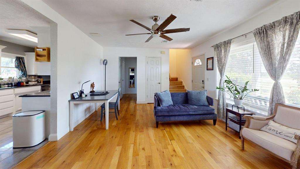 1766 Boss Range Road Justin, TX 76247 - Photo 14 of 35 a living room with furniture and a wooden floor