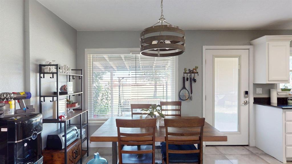1766 Boss Range Road Justin, TX 76247 - Photo 17 of 35 a view of a dining room with furniture window and outside view