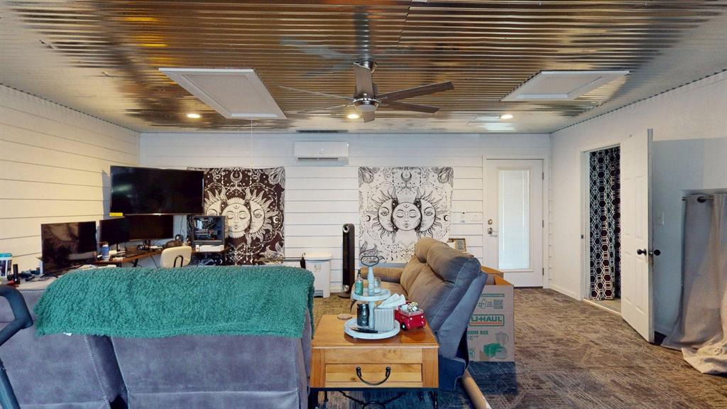 1766 Boss Range Road Justin, TX 76247 - Photo 21 of 35 a living room with furniture and a flat screen tv