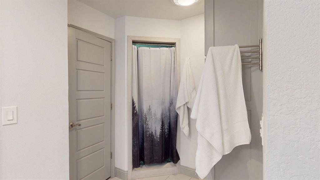 1766 Boss Range Road Justin, TX 76247 - Photo 25 of 35 a bathroom with a shower and a tub